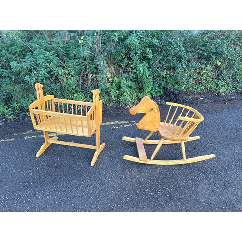 665 - Hand made carved wooden chair rocking horse and a wooden dolls crib, Marked with an Owl