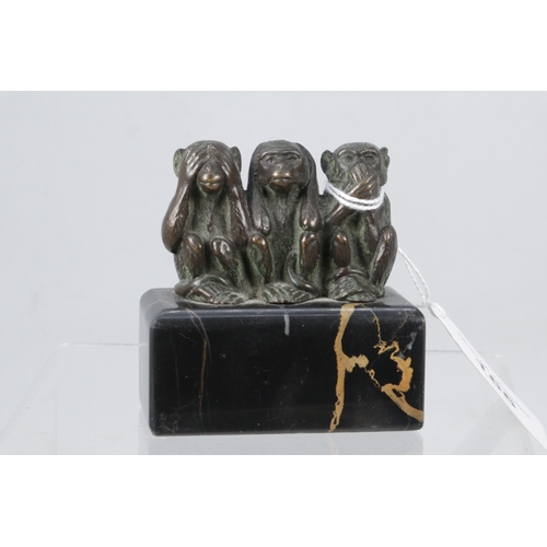 166 - Three bronze monkeys See No, Hear No and Speak No on marble plinth, approx. 6.5cm height.