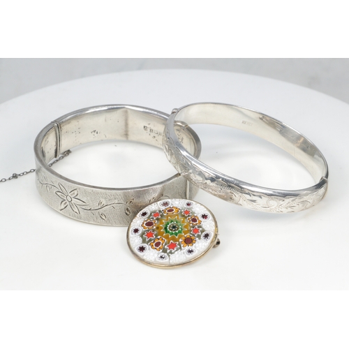 244 - Two silver hallmarked bangles and a millefiori brooch