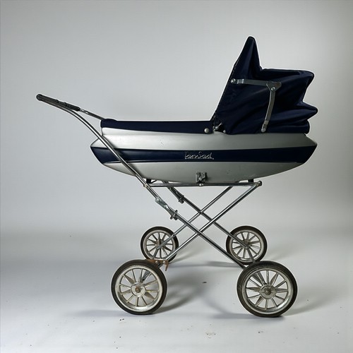 482 - A Tamsad child's folding push-along pram together with sally happy walk and talk doll and two other ... 