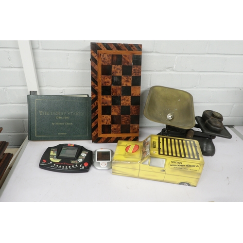 706 - A folding wooden chess board, small amount of cutlery, kitchen scales and the Derby Stakes 1780 to 1... 