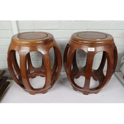 707 - Two oriental hardwood barrel shaped side tables