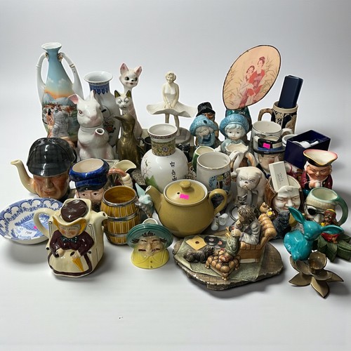 708 - A quantity of assorted novelty teapots, character jugs, tobys jugs, metalware, brass duck etc