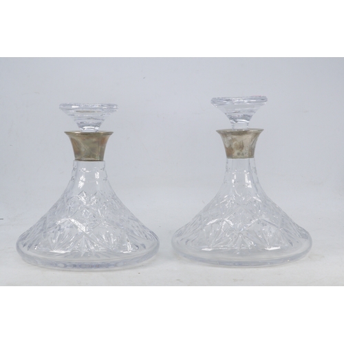 44 - Pair of Silver collared ships decanters with stoppers.