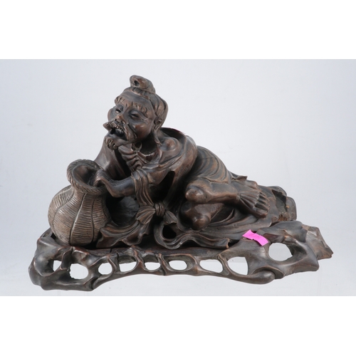 68 - Carved oriental elder figure on separate base.