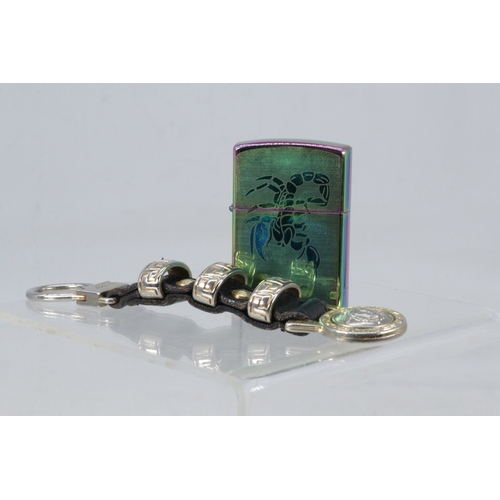 186 - Versace key ring, Zippo lighter