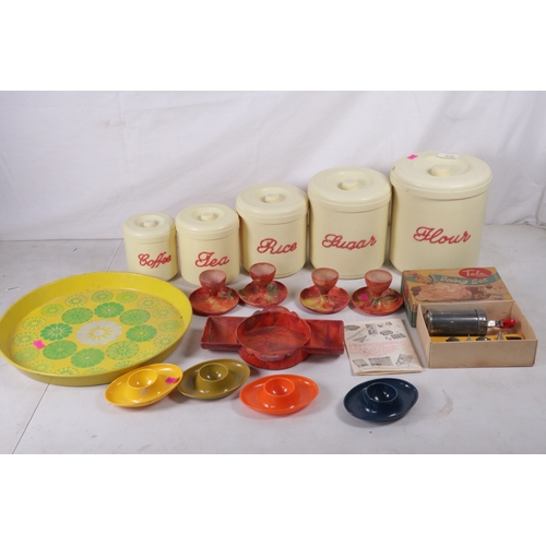 353 - Set of vintage kitchen plastic storage pots and covers, Coloured bakelite egg cups