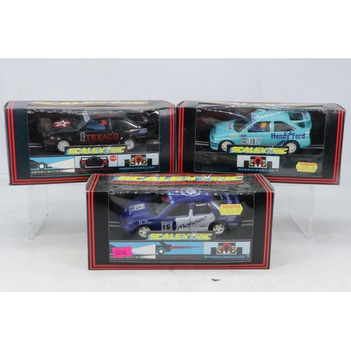 428 - Three boxed Scalextric model racing cars to include C403 Ford Escort Cosworth Hendy, C424 Ford Coswo... 
