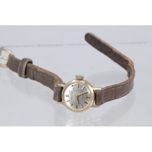 130 - A 9ct gold cased ladies accurst wristwatch with leather strap