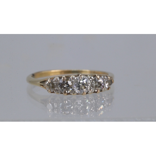 132 - 18ct gold ring set with five graduated small diamonds (approx. weight 2.5g)