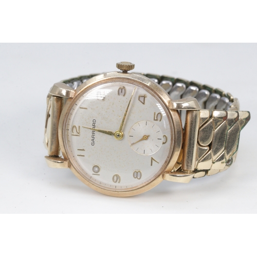 166 - A Garrard yellow metal wristwatch