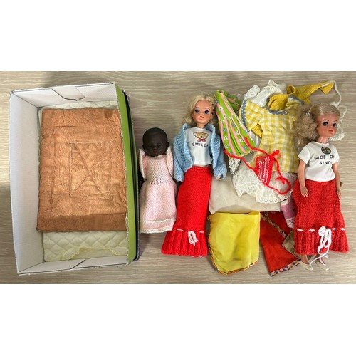 430 - Two vintage Sindy dolls with some clothing together with a small Pedigree doll.