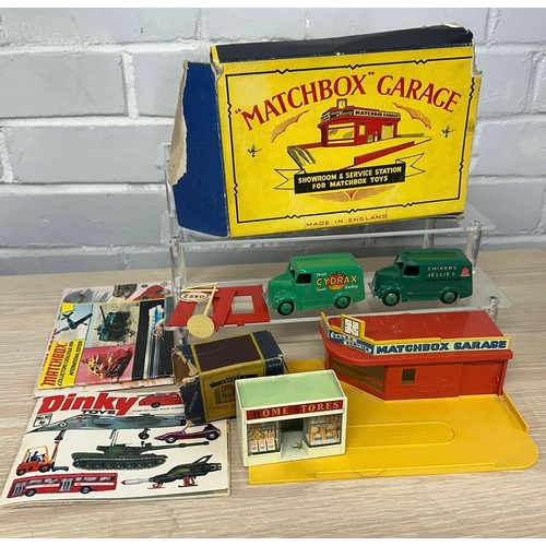544 - Matchbox garage together with a matchbox home store, loose dinky magazines etc