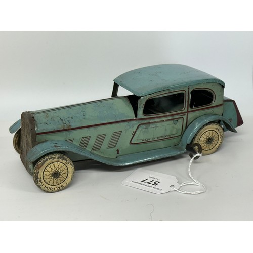 577 - Vintage Wells tinplate saloon car made in England finished in original blue paint with purple detail... 