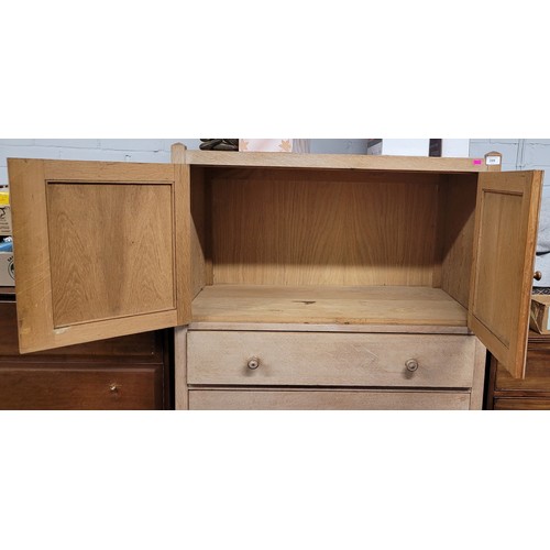 399 - Limed Oak finished tall boy cabinet fitted cupboard top and four drawers, Heals of London, Measures ... 