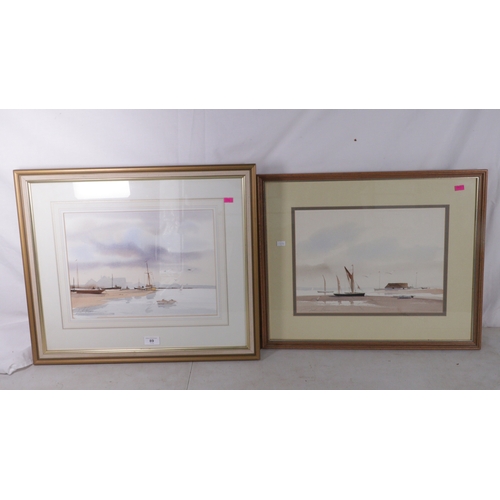 89 - Two framed watercolours of sailing boats at low tide by John? Surname illegible