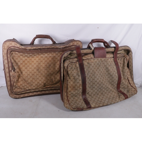 396 - Two vintage Gucci suitcases, showing use  and wear,