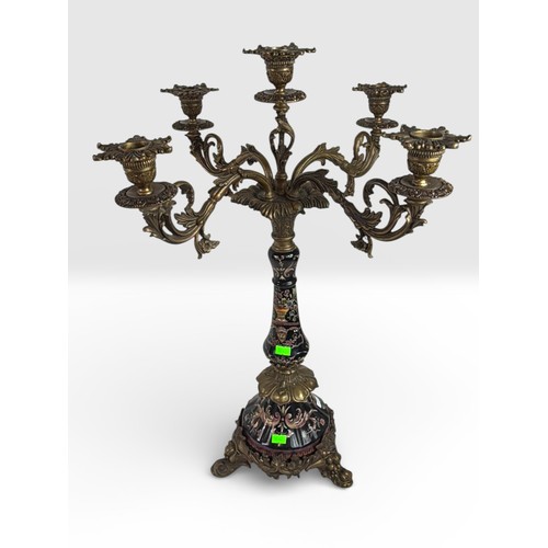 60 - Cast metal 5 flame candelabra, decorated with pink and yellow flowers on black background.