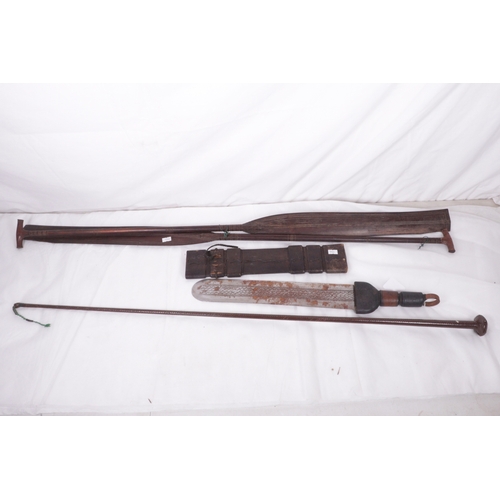 253 - Tribal knife and sheath together with two tribal oars