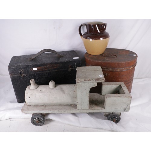 392 - An old wooden toolbox, metal hat case, and a rustic handmade train