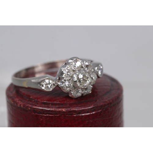 128 - 18ct white gold ring set with centre diamond and circled with 8 diamonds and two more on the shoulde... 