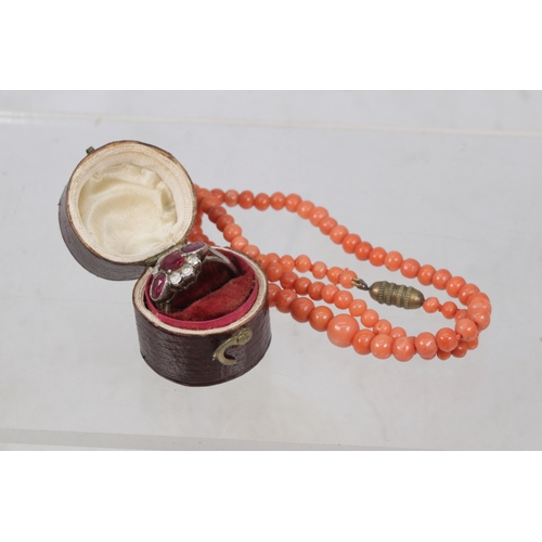 131 - Coral beaded necklace with a silver and paste set ring