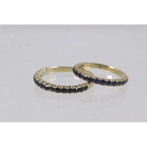 135 - two 14ct gold sapphire half eternity rings