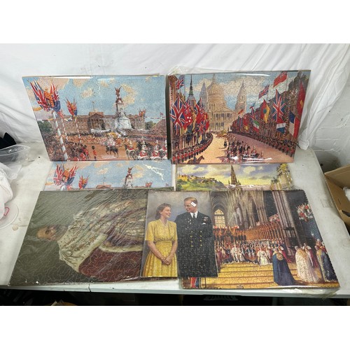 269 - A collection of finished commemorative Royal interest puzzles various ages and includes card and woo... 