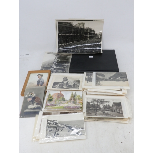245 - A quantity of postcards many commemorative, intermixed with some topographical, and a smaller album ... 