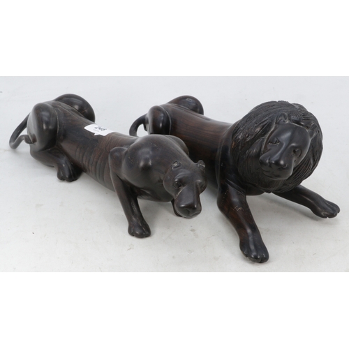 248 - A carved lion and puma