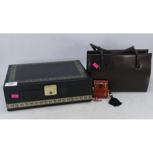 256 - Vintage handbag, Yves Saint Laurent Opium perfume, empty rexine jewellery box and a silver backed co... 