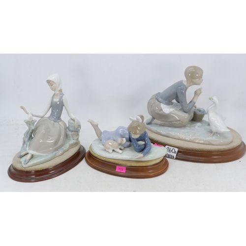 260A - A selection of assorted Lladro figurines girl with Puppy, lady with geese etc examine