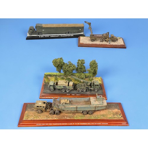 15 - A group of four detailed diorama models, including a DUKW amphibious landing craft scene, Foden reco... 