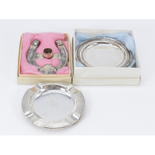 273A - Two silver hallmarked cigarette ashtrays, Anderson miniature coasters and horseshoe candle holder.
