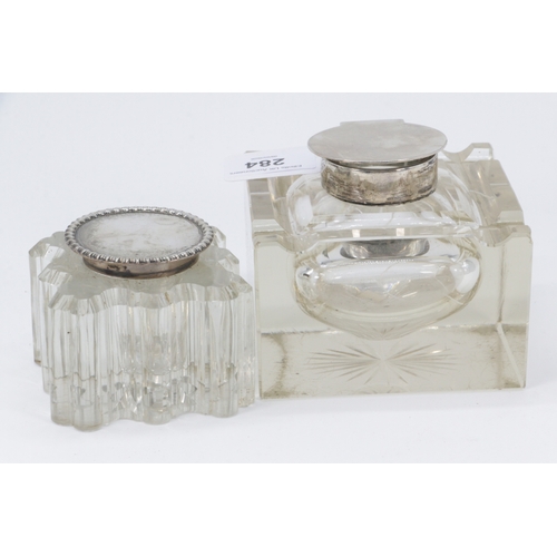 284 - Two decorative glass inkwells with silver lids