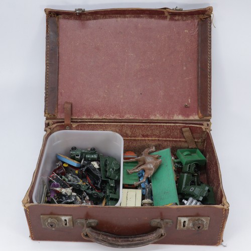 233A - Small suitcase of assorted vintage toys, Diecast, Timpo.