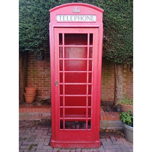 A vintage K6 telephone box, front opening model with a 1936 Tudor crown (quite rare) four original glass telephone signs which is unusual as most were positioned against a wall which meant there was there was no need for a rear sign, fully stripped and painted in original post office red.