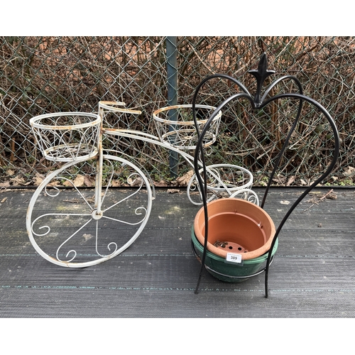 389 - Metal plant stand in the form of bicycle together with Crown plant stand