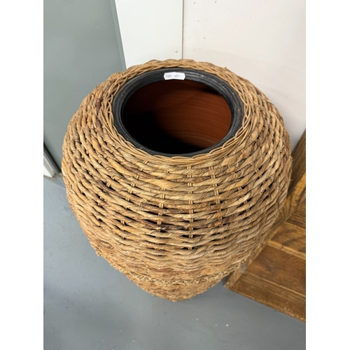 139 - Large floor standing terracotta vase with a wicker wrap - Approx. H124cm