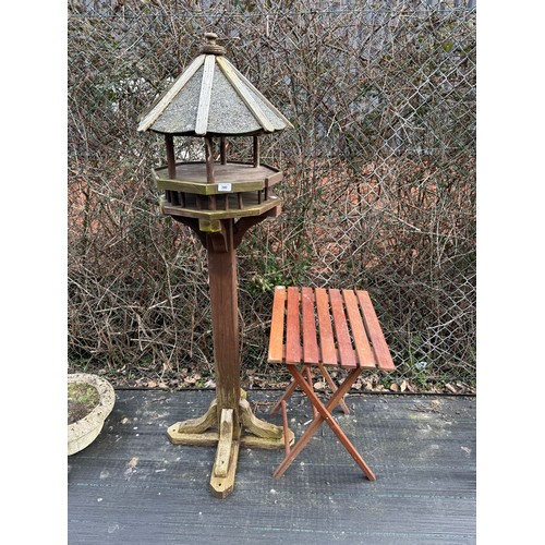 390 - Wooden bird feeder together with teak side table