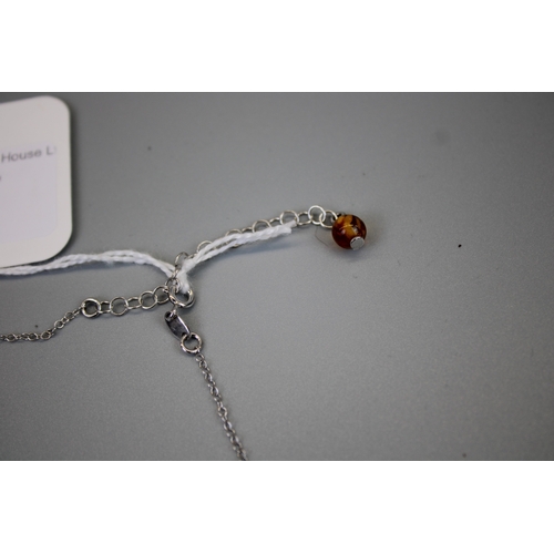 67 - Silver Amber Set Pendant on Silver Chain