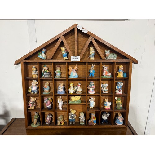 Collection of Animal Figurines in Wooden Display Case
