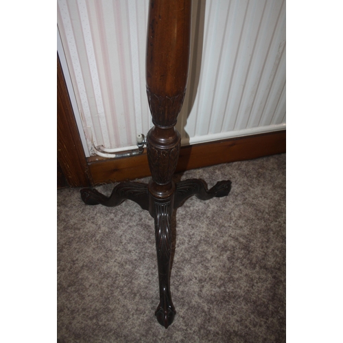 1001 - A late 19th Century mahogany torchere on ball and claw feet, 49 1/2