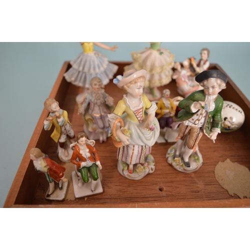 102 - A mixed lot of antique and vintage miniature figures including Dresden crinoline dancers, gold ancho... 