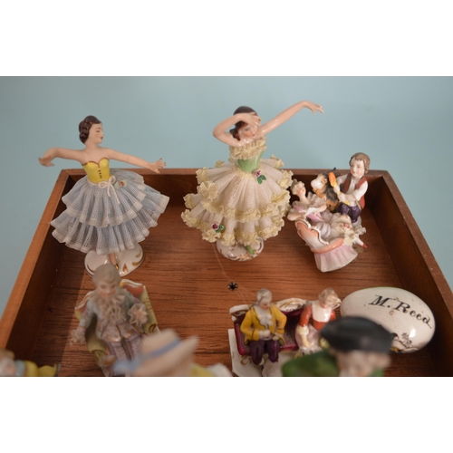 102 - A mixed lot of antique and vintage miniature figures including Dresden crinoline dancers, gold ancho... 