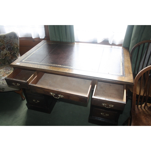 1040 - An Edwardian oak three part pedestal desk with leather top, width 48