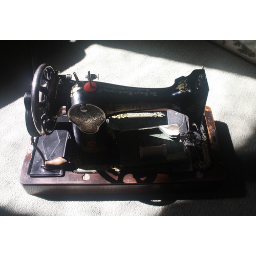 1045 - A cased Singer sewing machine