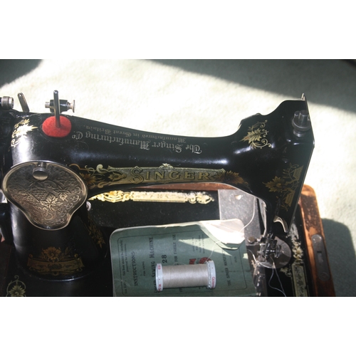 1045 - A cased Singer sewing machine