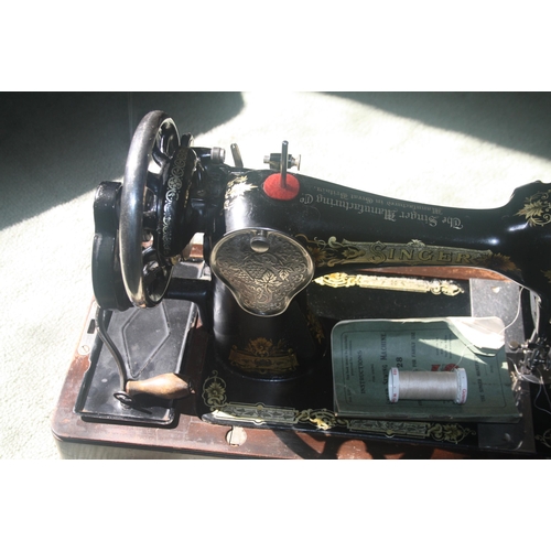 1045 - A cased Singer sewing machine