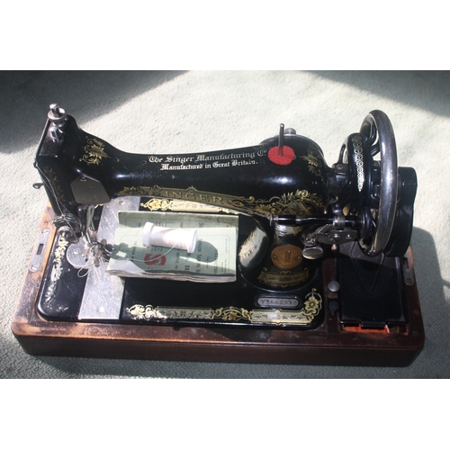 1045 - A cased Singer sewing machine